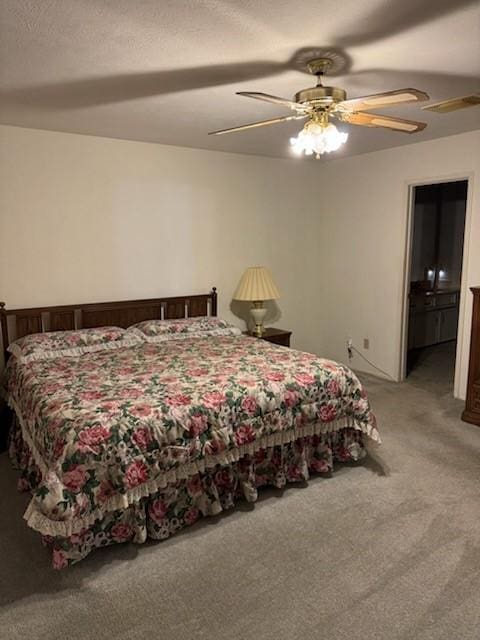 bedroom featuring light colored carpet and ceiling fan