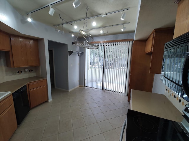 kitchen featuring light tile patterned floors and black appliances