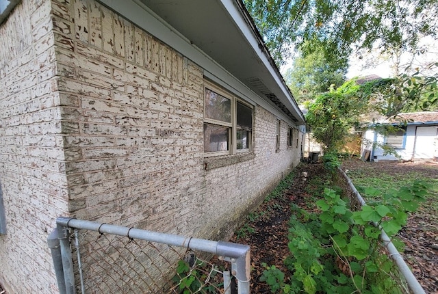 view of side of home featuring cooling unit