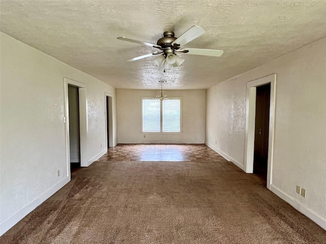 carpeted empty room featuring ceiling fan and a textured ceiling