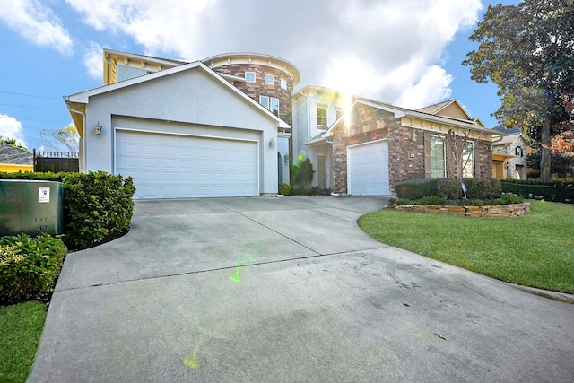 view of front of home featuring a garage and a front yard