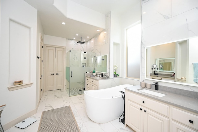 bathroom featuring shower with separate bathtub and vanity