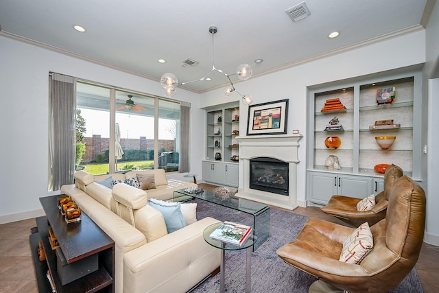 living room with crown molding and built in features