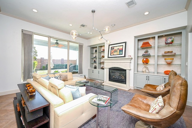 living room with ornamental molding and built in features