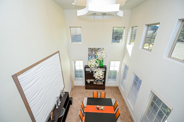 living room with a high ceiling