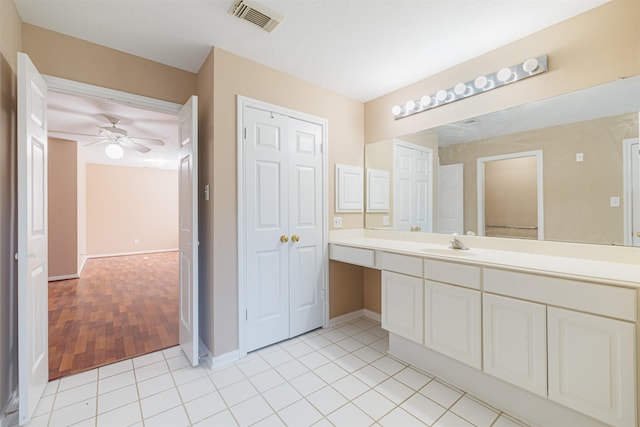 bathroom with ceiling fan, vanity, and tile patterned flooring