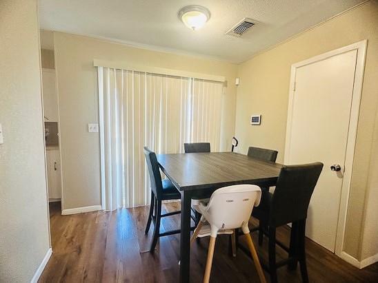 dining room featuring dark wood-type flooring