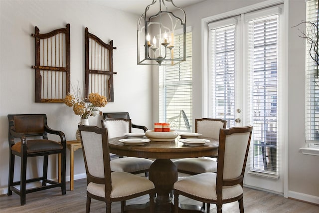 dining room featuring a notable chandelier and hardwood / wood-style floors