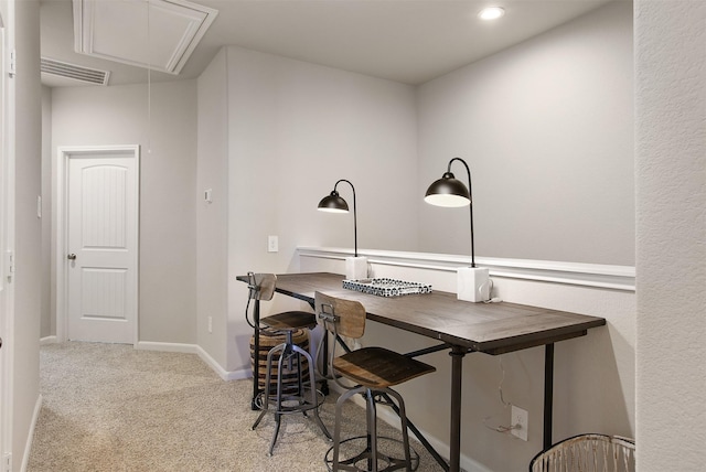 dining area with light colored carpet