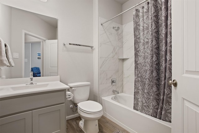 full bathroom with vanity, toilet, hardwood / wood-style floors, and shower / bath combo