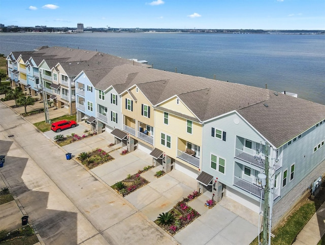 drone / aerial view with a water view