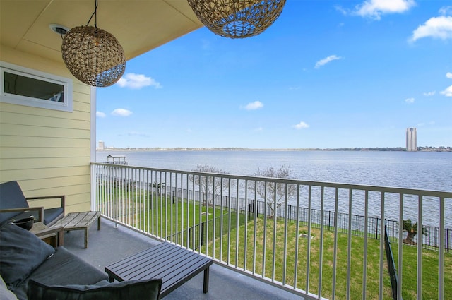 balcony featuring a water view