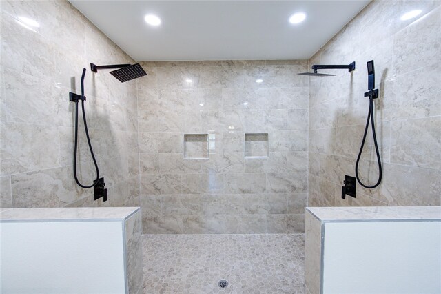 bathroom with a tile shower