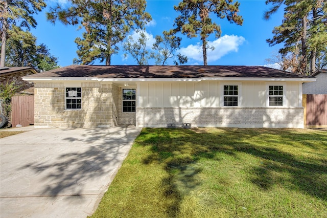 view of side of property with a yard