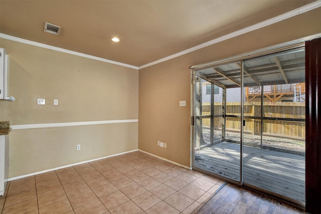 tiled empty room featuring ornamental molding