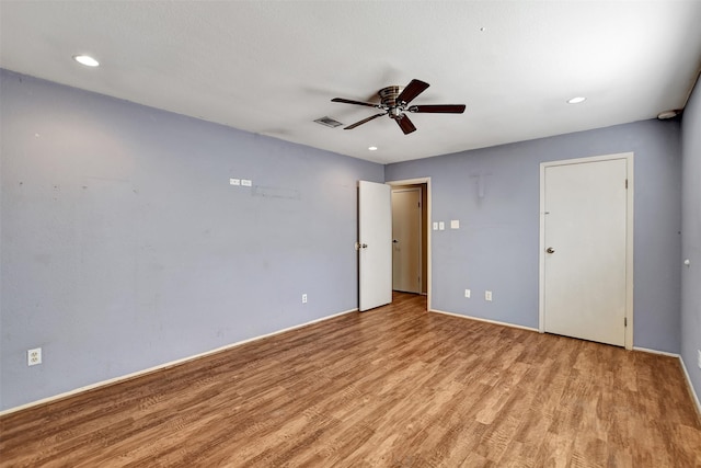 empty room with light hardwood / wood-style flooring and ceiling fan