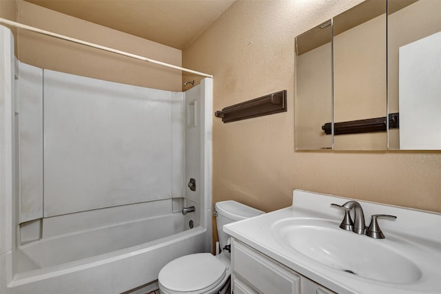 full bathroom featuring vanity, bathing tub / shower combination, and toilet