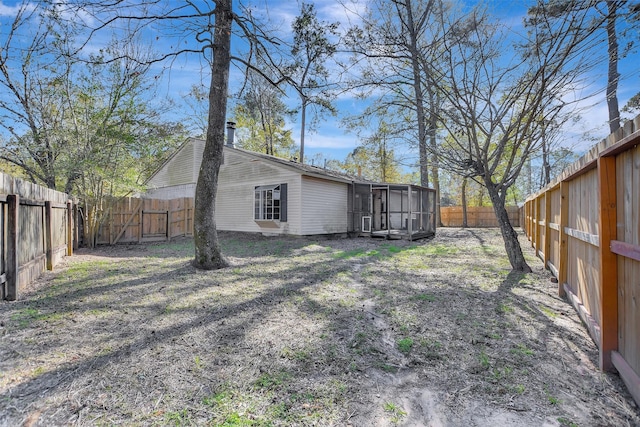 view of yard with a sunroom