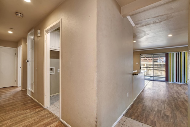 corridor with light tile patterned flooring