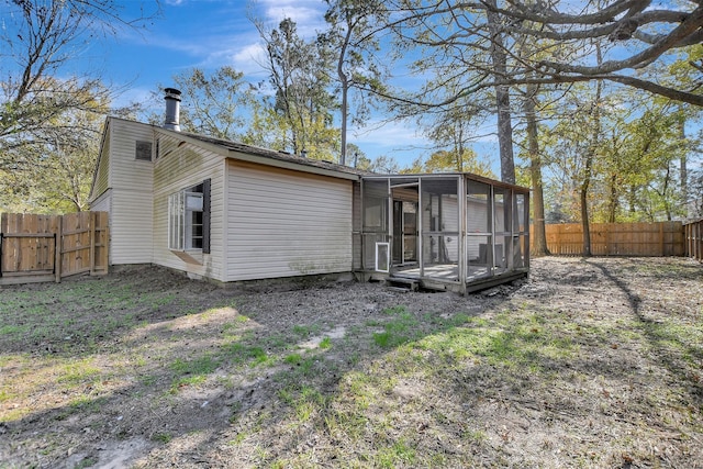 back of house with a sunroom