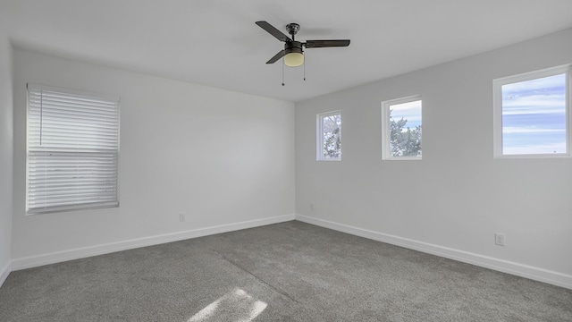 carpeted empty room with ceiling fan