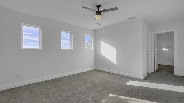 carpeted empty room with ceiling fan