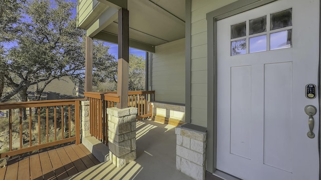 view of exterior entry featuring a porch