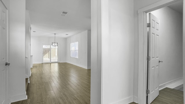 corridor featuring dark hardwood / wood-style flooring