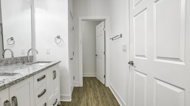 bathroom with vanity and hardwood / wood-style flooring