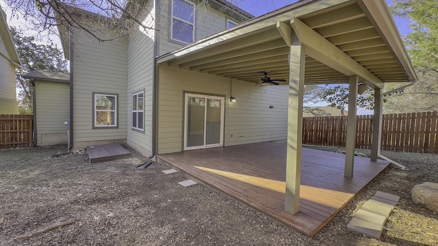 exterior space featuring a wooden deck and ceiling fan