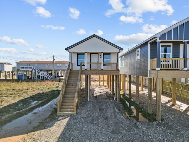 view of front of house featuring a carport and a porch