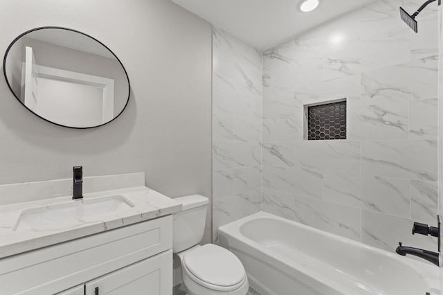 full bathroom with vanity, toilet, and tiled shower / bath