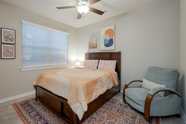 bedroom with hardwood / wood-style flooring and ceiling fan