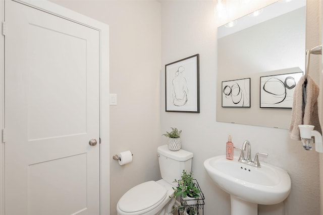 bathroom with toilet and sink