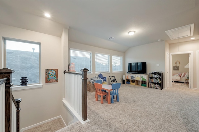 playroom featuring vaulted ceiling and carpet