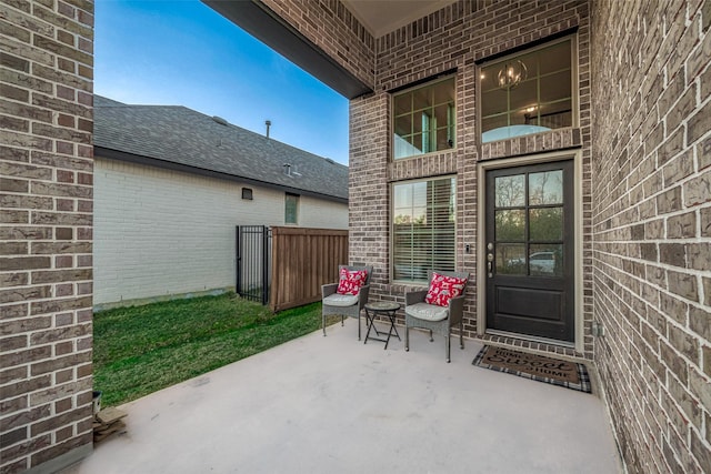 entrance to property with a patio area