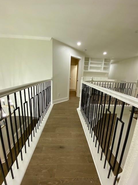 hall with ornamental molding and dark hardwood / wood-style flooring