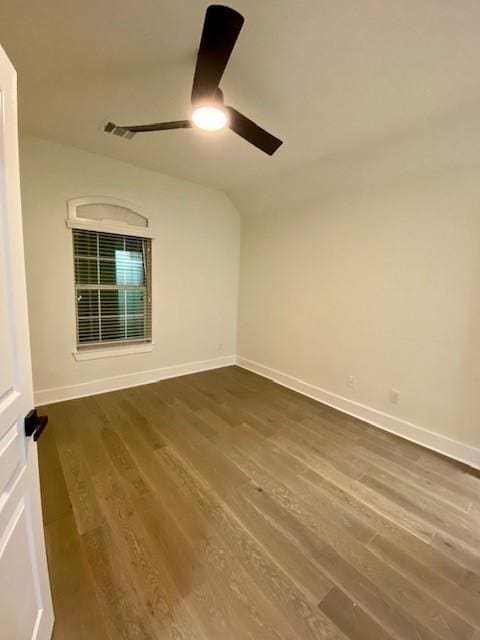 unfurnished room featuring hardwood / wood-style flooring, vaulted ceiling, and ceiling fan