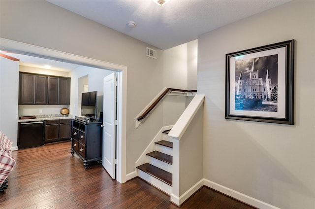 staircase featuring wood-type flooring