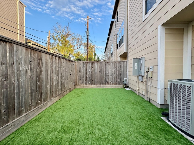 view of yard with central AC