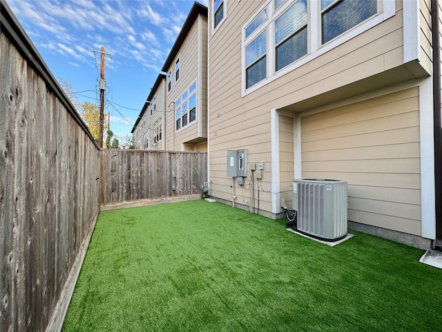 view of yard featuring central AC unit