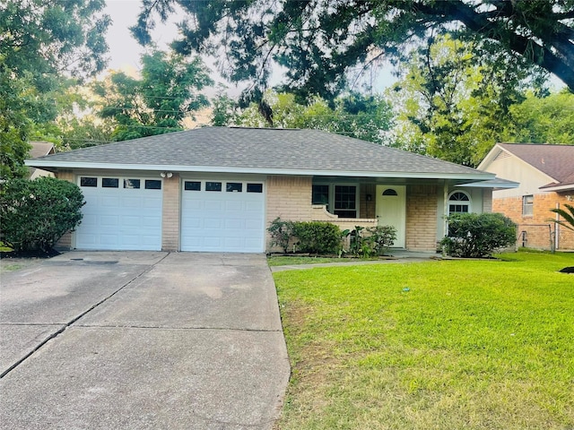 ranch-style home featuring a garage and a front yard