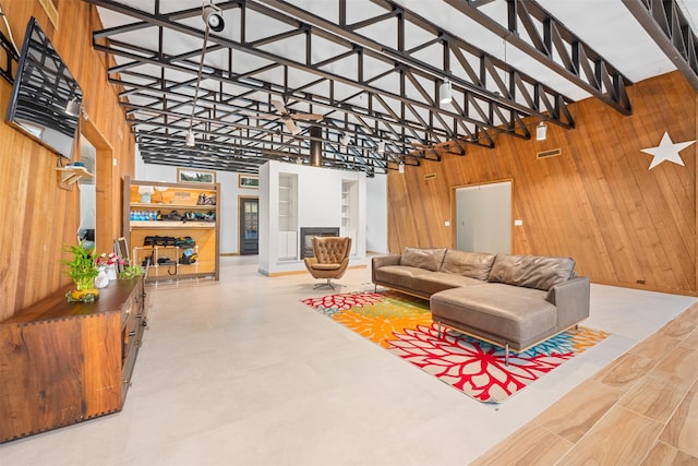 living room with wood walls