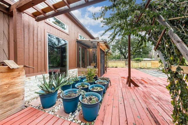 wooden terrace with a sunroom