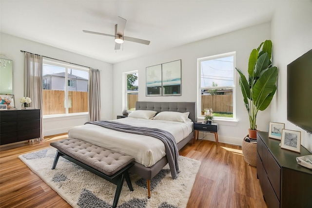 bedroom with wood-type flooring and ceiling fan