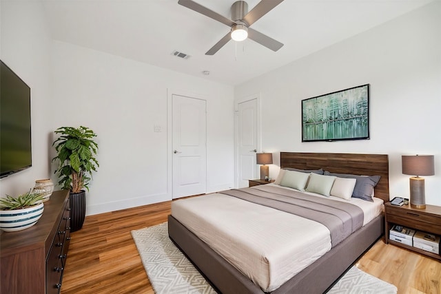 bedroom featuring ceiling fan and light hardwood / wood-style floors