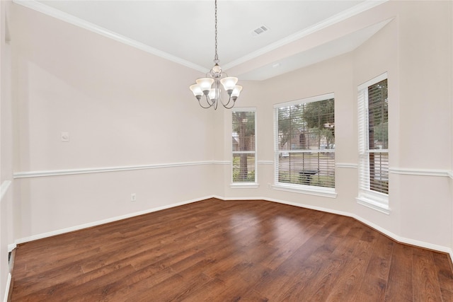 unfurnished dining area featuring crown molding, hardwood / wood-style floors, and a notable chandelier