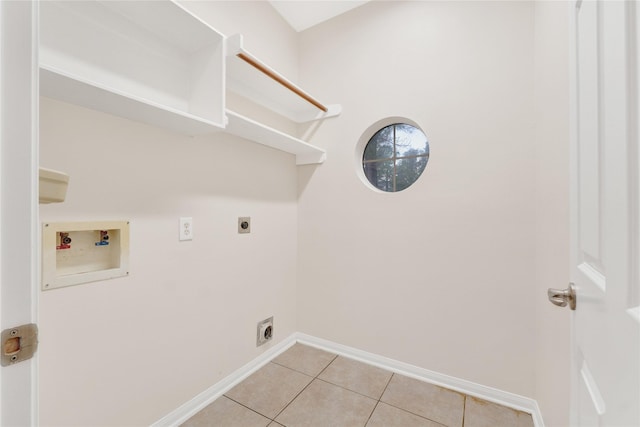 washroom featuring hookup for an electric dryer, washer hookup, and light tile patterned floors