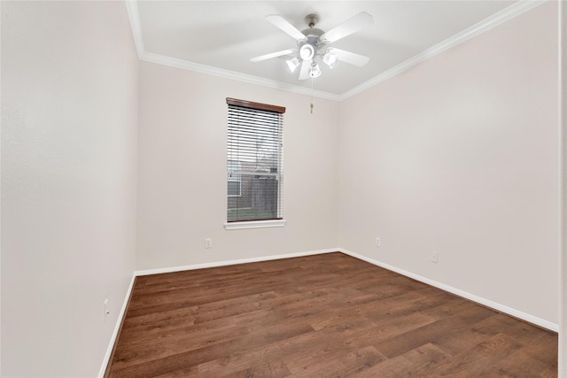 spare room with crown molding, ceiling fan, and dark hardwood / wood-style floors