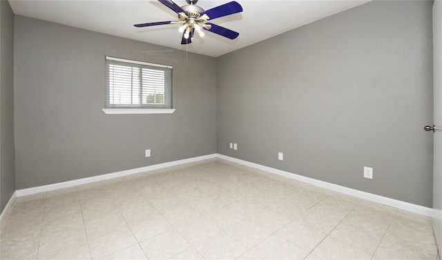 unfurnished room with ceiling fan and light tile patterned flooring